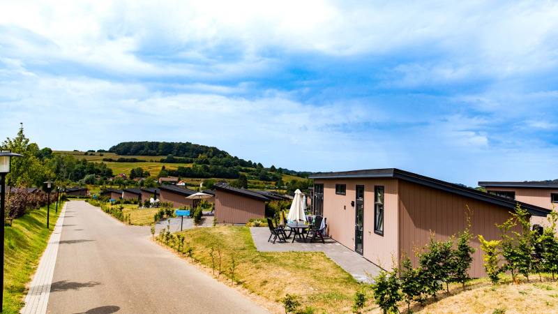 Holiday cabins at Résidence Valkenburg, Limburg, Netherlands, with scenic hills and countryside views.