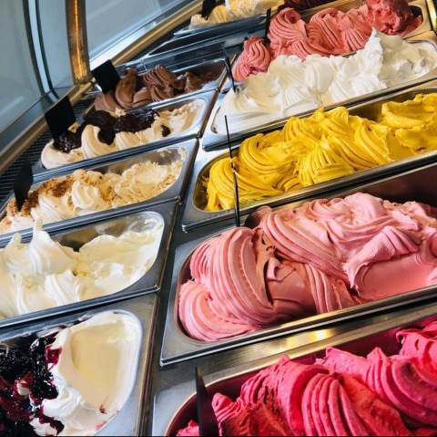 An assortment of colorful gelato ice cream in a display case, a highlight at Camping de Boskant in Limburg, Netherlands.