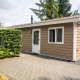 Udvendig udsigt af Heuvelrug Cottage Comfort lodge ved De Thijmse Berg i Nederlandene med terrasse.