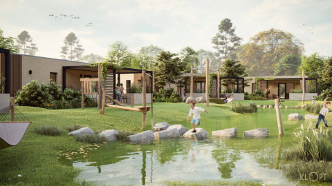 Children playing on rocks by water in Beloofde Land holiday park, Gelderland, Netherlands, modern lodges.