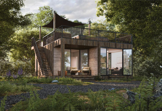 Moderne lodge met dakterras en grote ramen tussen bomen bij Resort de Parel, Nederland.