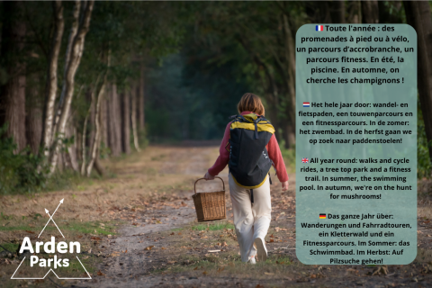 Persoon met rugzak en mand wandelt in bos, Arden Parks promoot jaarrond amusementsactiviteiten.