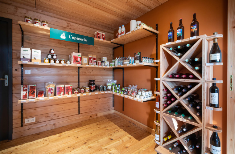 Small shop with local products and wines at Huttopia Pays de Cordes sur Ciel in Occitanie, France.