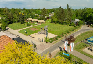 Aerial view of playground and green fields at Holiday Resort 't Schuttenbelt in Overijssel, Netherlands.