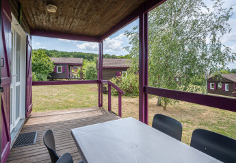 View from the terrace at Chalet ZEN, Camping Seasonova Les Vosges du Nord, France, overlooking nature.