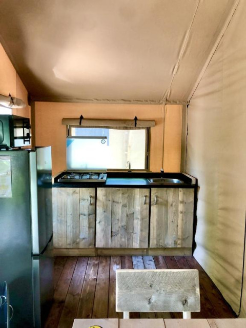 Kitchen area inside a safari tent at Slow Lodge, Village Seasonova Bassin d'Arcachon, France.