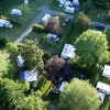 Aerial view of Camping Seasonova Les Plages de Loire showing caravans and lush greenery in France.