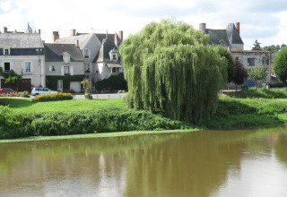 Landscape at Camping Seasonova Les Plages de Loire in Pays de la Loire, France, with river and willow tree.