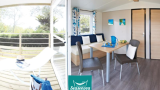 Bright, modern interior of Cottage Zen lodge with terrace, dining table and lounge space on a summer day.