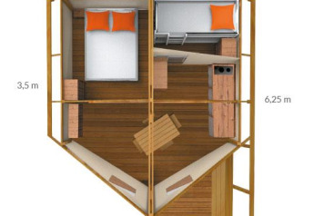 Floor plan of a safari tent showing bedroom, kitchen, dining area, and measurements in meters.