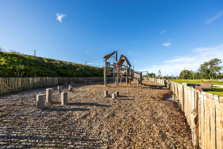 Playground with wooden play structures at Domaine Seasonova Saâne et Mer holiday park in Normandy, France.
