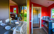 Vista interior de la cocina y comedor de la tienda safari Mobilodge en Camping Seasonova La Forêt, Francia.