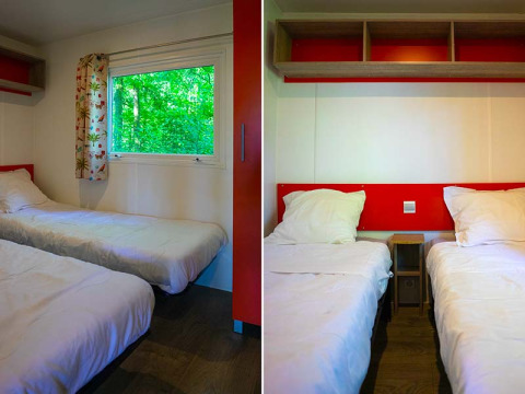Dos camas individuales en una tienda safari Mobilodge moderna en Camping Seasonova La Forêt, Francia.