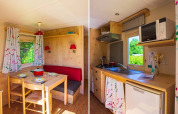 Gemütliches Gipsy-Wagon-Interieur auf Camping Seasonova La Forêt in Frankreich mit Ess- und Küchenbereich.