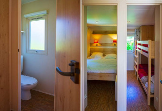 Interior view of a Gipsy wagon at Camping Seasonova La Forêt in France, showing toilet and bedrooms.