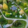 Aerial view of Camping Seasonova Le Martinet holiday park in Centre-Val de Loire, France, with motorhomes and trees.