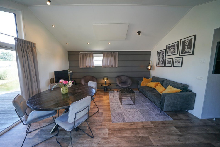 Modern living and dining area at Lodge Berkel, EuroParcs Veluwemeer, Netherlands, with stylish décor.