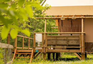 Desert Lodge safari tent with private sanitation at Camping Centro Vacanze San Marino in Italy, nature view.