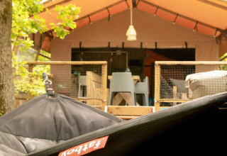 View of a Desert Lodge safari tent with private bathroom at Camping Centro Vacanze San Marino, Italy.