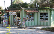 Small shop at Campo dei Fiori holiday park in Tuscany, Italy, selling newspapers, postcards, and groceries.
