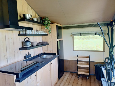 Modern kitchen area inside a safari tent at Farm Campsite the Katreel, Boerderijcamping het Katreel, Netherlands.