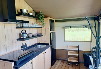 Modern kitchen area inside a safari tent at Farm Campsite the Katreel, Boerderijcamping het Katreel, Netherlands.