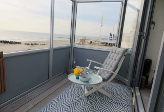 Afslappende altanudsigt mod stranden fra Beach house 'Dishoek 60' i Zeeland, Dishoek, Holland.