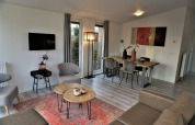 Modern living and dining area of Pavilion 4 at Zuiderzee in the Netherlands, featuring contemporary décor.