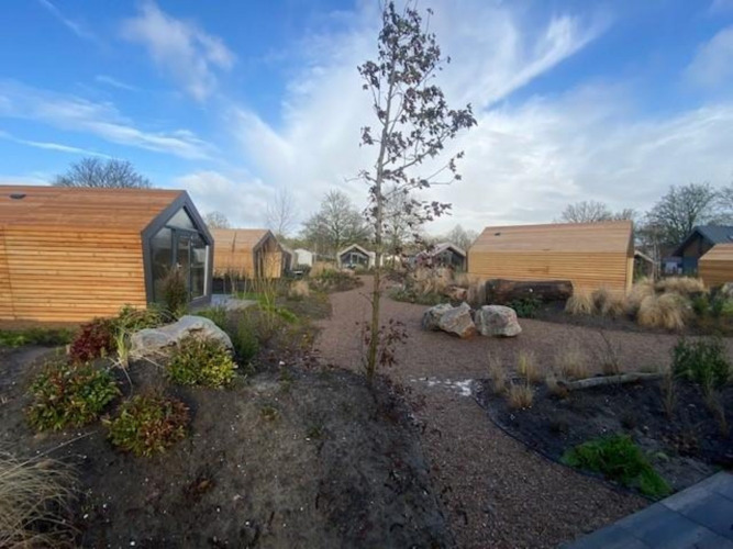 Solo Retreat 2 at Zuiderzee in the Netherlands, featuring modern wooden lodges set in landscaped gardens.