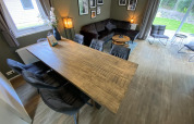 Modern Velthorst 6 lodge at De Utrechtse Heuvelrug, Netherlands, featuring dining table and cozy lounge.