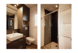 Salle de bain moderne au Belsano Lodge, Poort van Maastricht, Pays-Bas, avec douche, lavabo et WC.