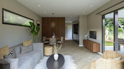 Sala de estar moderna en la cabaña Loevestein de Veluwepark de Bosgraaf con decoración elegante y vista al jardín.