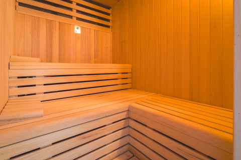 Interior view of a modern wooden sauna at Camping Costa del Sol Glamping Village in Andalusia, Spain.