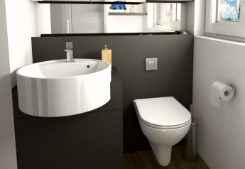 Moderne badkamer in Panorama Cottage, Gulperberg, Nederland, met wastafel, toilet en raam.