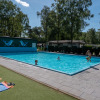 Children playing in the outdoor swimming pool at Recreatiepark de Wrange, Gelderland, Netherlands.