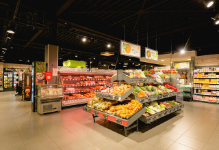 Fresh produce and dairy section inside the supermarket at Camping de Schatberg holiday park in Limburg, Netherlands.