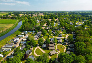 Aerial view of Vakantiepark de Twee Bruggen holiday park set in green fields in Gelderland, Netherlands.