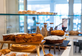 Cakes and pastries displayed in a café at Vigna sul Mar Family Camping Village, Emilia-Romagna, Italy.