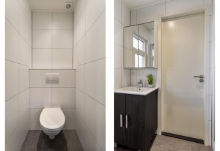 Moderne lodgebadeværelse på Bospark Ede i Holland med ophængt toilet og vask i Module Special Wellness.