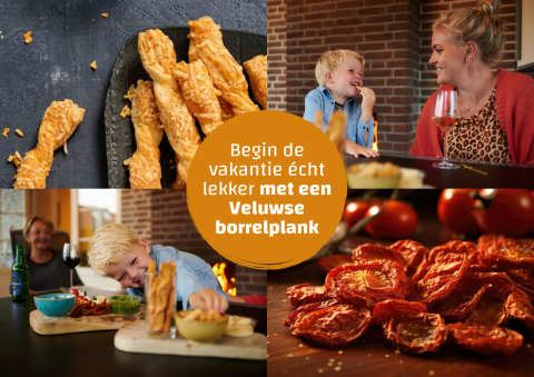 Gezin smult van een Veluwse borrelplank met kaasstengels en tomaatjes in een knusse tiny house.