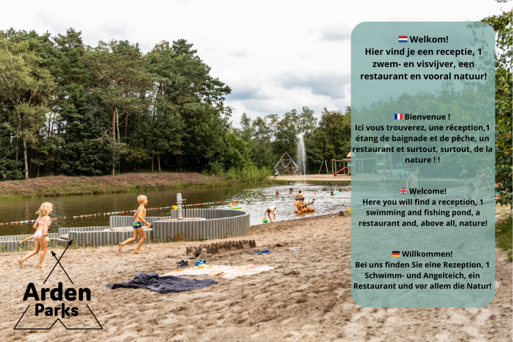 Children playing on a sandy beach by a pond at a glamping site in Arden Parks, with trees in the background.