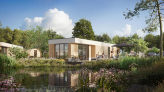 Udsigt over Water lodge 6 Deluxe med sauna og spabad, moderne lodge ved sø omgivet af natur, solskin og afslappede gæster.