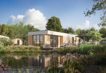 Udsigt over Water lodge 6 Deluxe med sauna og spabad, moderne lodge ved sø omgivet af natur, solskin og afslappede gæster.