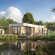 Udsigt over Water lodge 6 Deluxe med sauna og spabad, moderne lodge ved sø omgivet af natur, solskin og afslappede gæster.