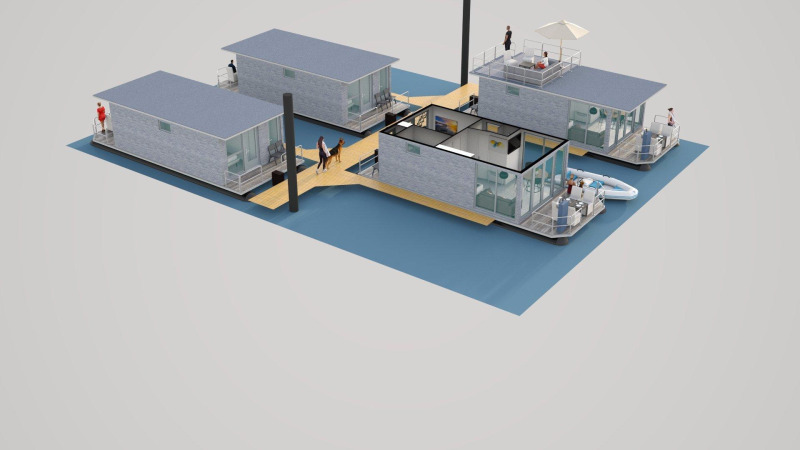 Vista aérea de casas flotantes conectadas en Marina Mookerplas, Países Bajos, con personas en los muelles.