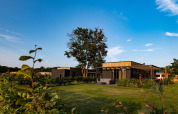 Outdoor view of Holiday villa Amalia at Hofparken Wiltershaar, Netherlands, surrounded by green nature.