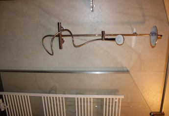 Shower in a tiny house at Cuckoo's Nest, Camping de Koeksebelt, Netherlands, with modern fixtures.