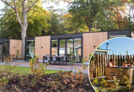 Veluwehoeve Wellness lodge with outdoor dining area and circular wooden hot tub set in a natural setting.