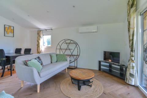 Chic living area in a wheelchair accessible luxury lodge at Drentse Weelde, Netherlands.