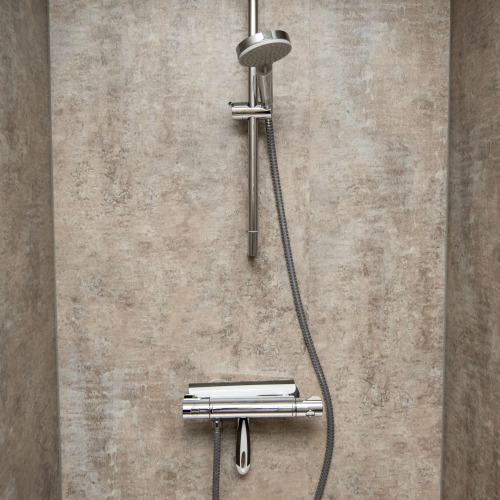 Modern shower with chrome fittings and hose in the bathroom of Houseboat 'De Waterparel' in Friesland.
